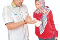 Bupati Pesawaran, Dendi Ramadhona bersama sang istri Nanda Indira Bastian. (foto: ist)